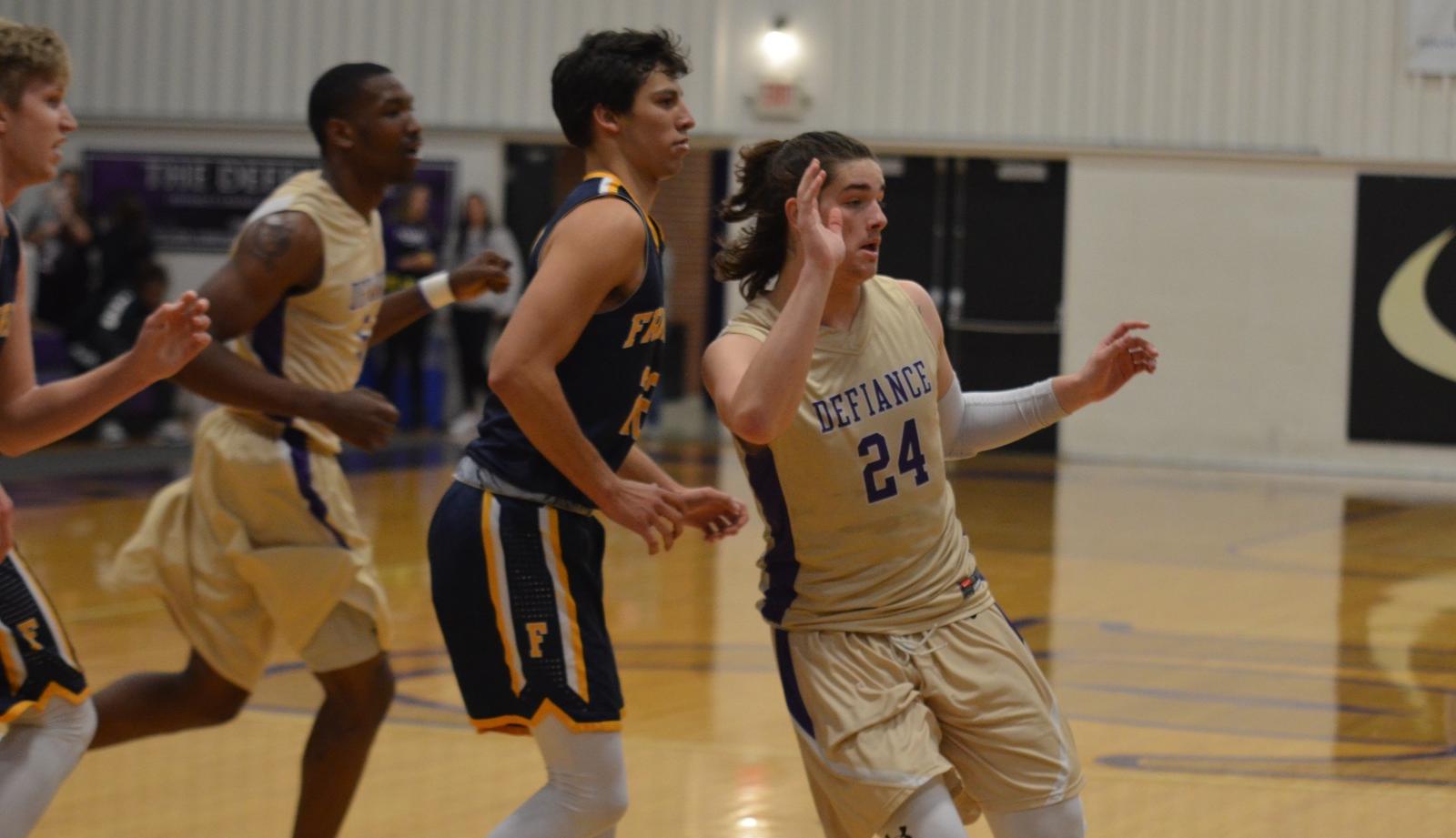 Men's Basketball Tamed by the Lions